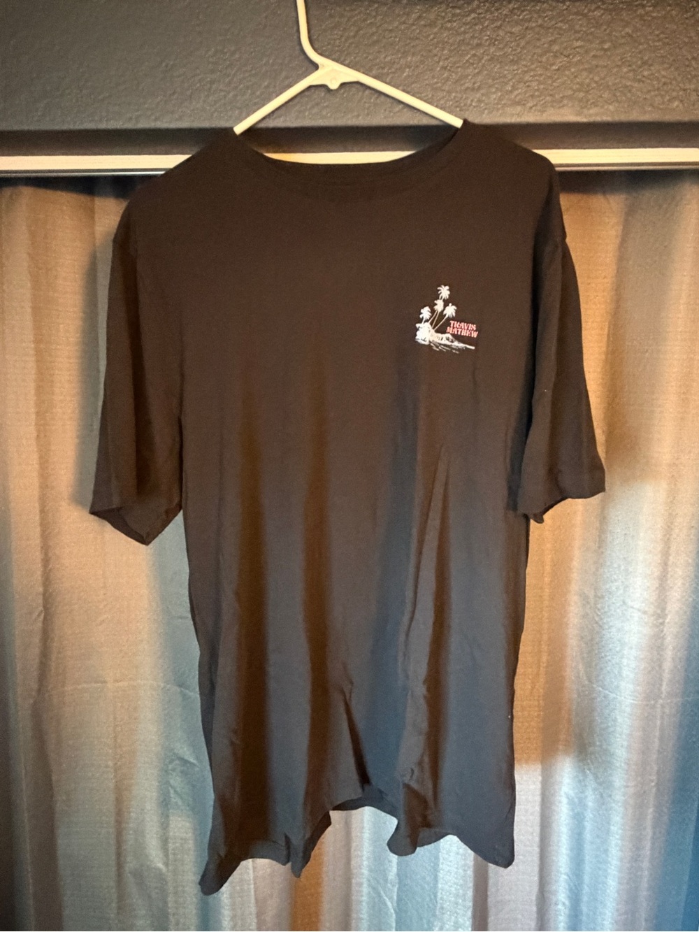 Travis Mathew Black Short-Sleeve Tee with Small Left-Chest Graphic
